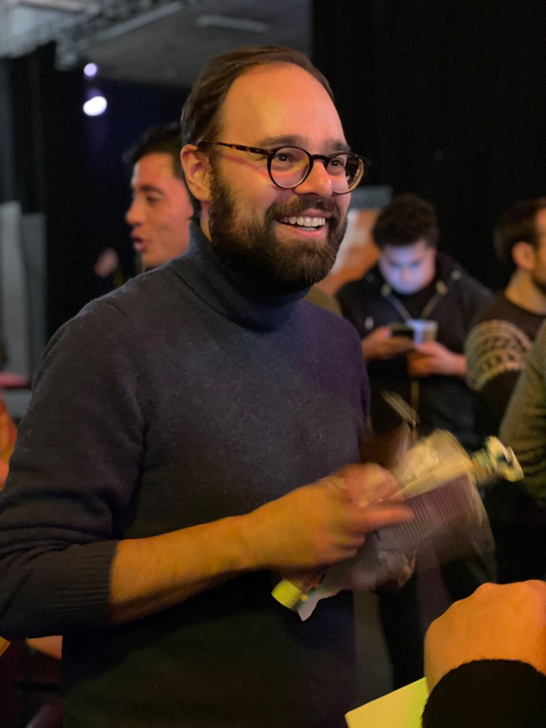 Thierry smiling at a gathering.